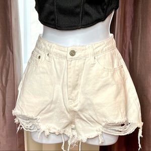 White denim shorts with fringe